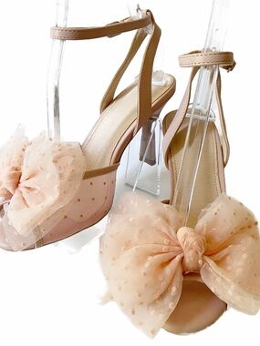 Pink Salmon Bow heels feature an oversized, flouncy polka-dot tulle bow toe.